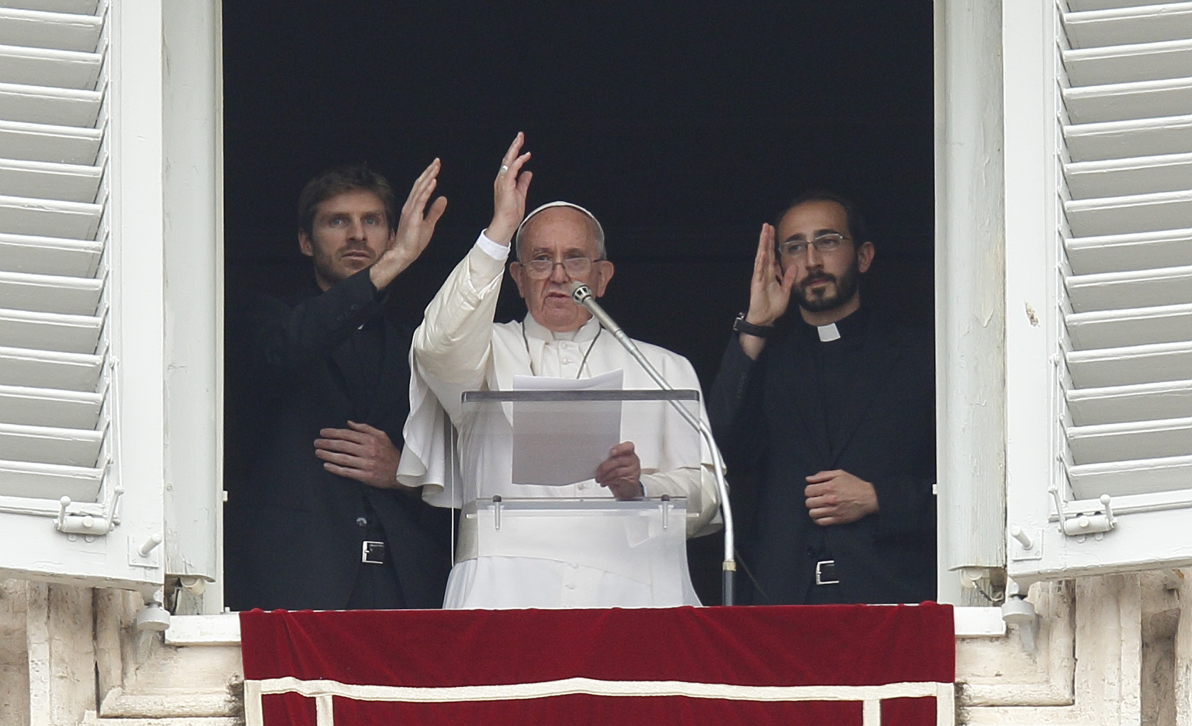 Pope Francis, two newly ordained priests give blessing during 'Regina Coeli' at Vatican